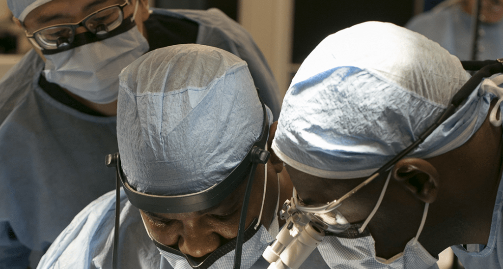 Hair transplant surgeons at work