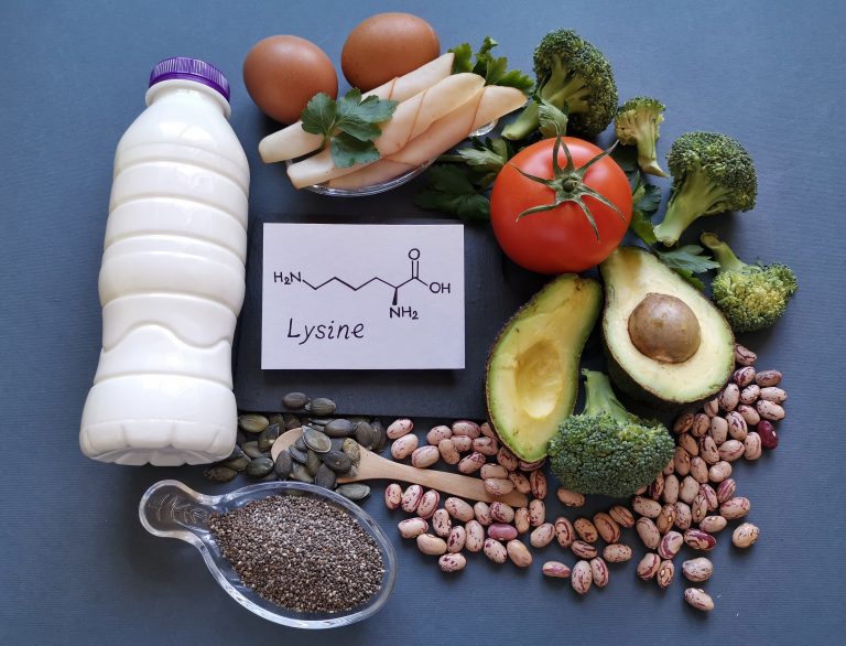 Foods rich in lysine (an essential amino acid) with structural chemical formula of lysine. Natural food sources of proteins. High protein food products: avocado, eggs, milk, broccoli, beans, chia seed
